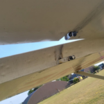 Left aileron outboard hinge with missing clevis pin. Photo taken from underneath.