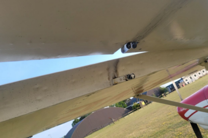Left aileron outboard hinge with missing clevis pin. Photo taken from underneath.