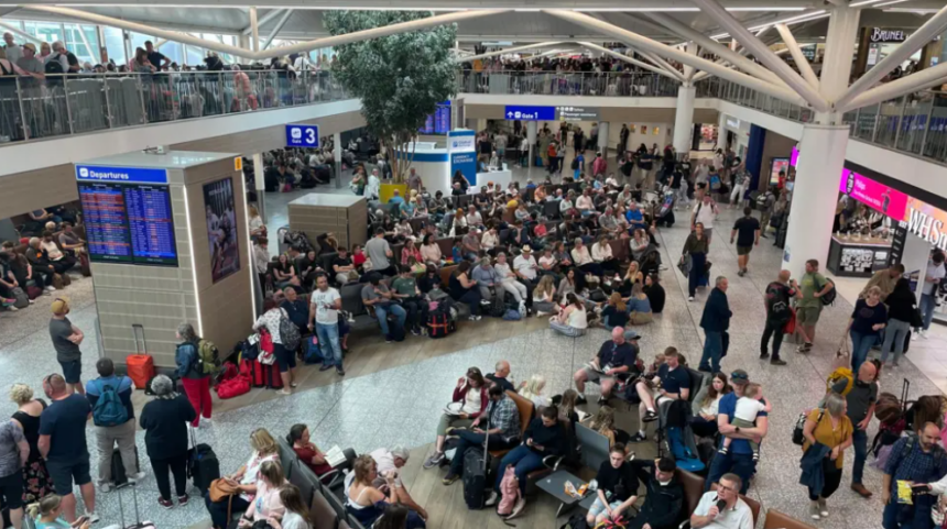 A busy airport waiting area filled with people sitting down