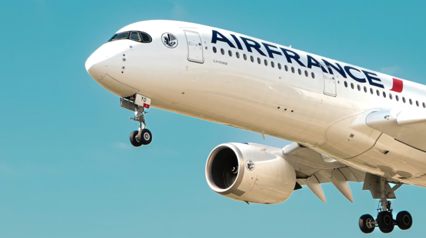 A large Air France jet flying through a blue sky