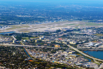 An aerial view of an airport under a blue sky