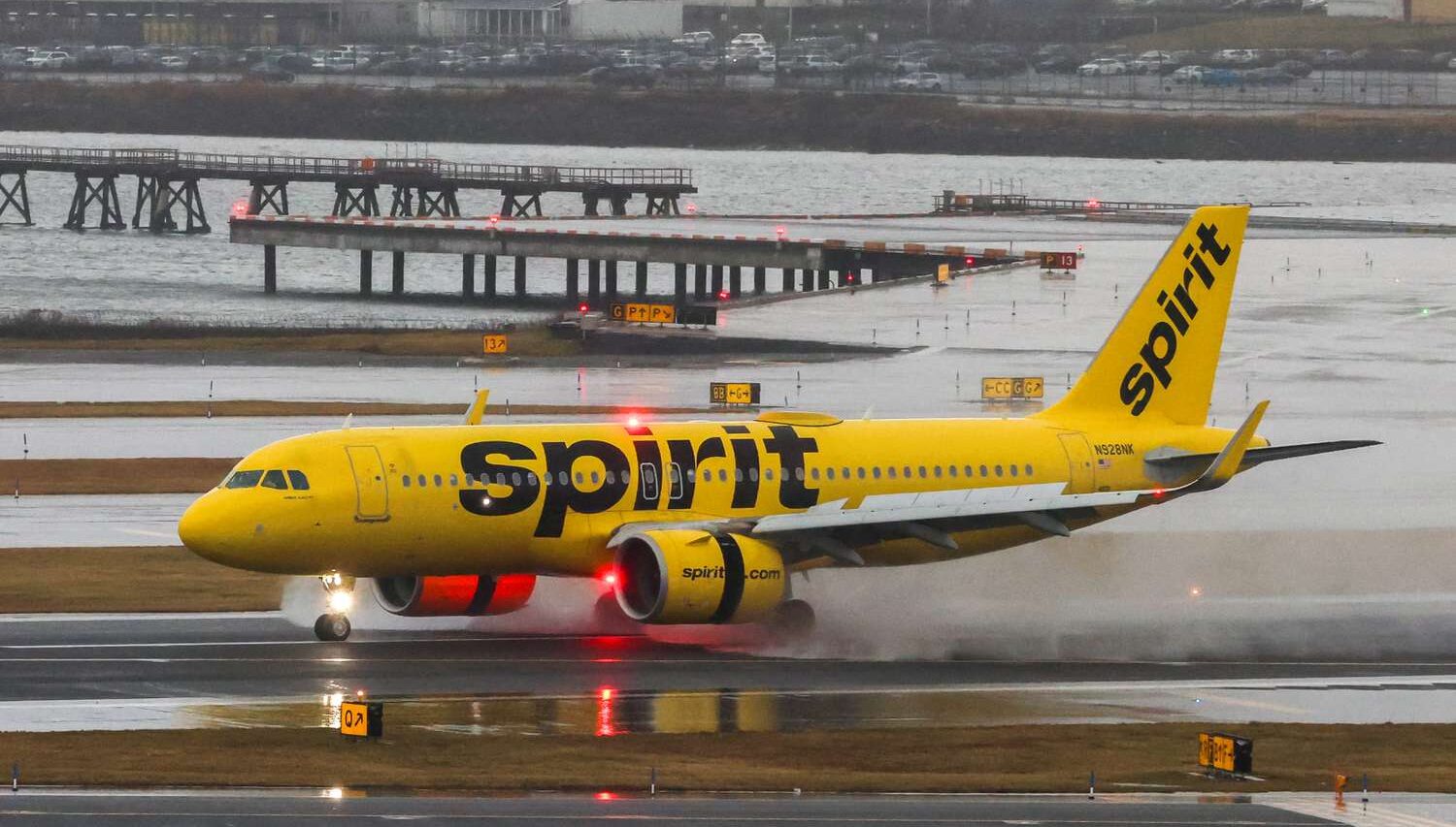 Spirit Airlines A330 aircraft taking off from wet runway