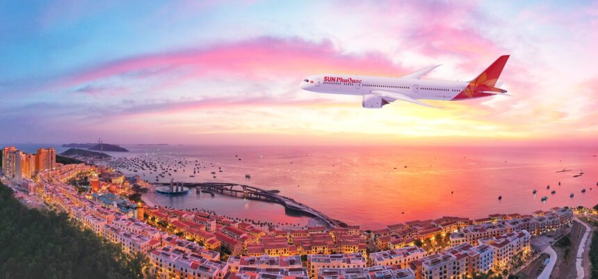 Sun PhuQuoc aircraft flying over an island. Sunset and the ocean in the background.