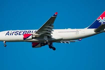 Air Serbia Airbus A330-200 flying on blue sky near JFK