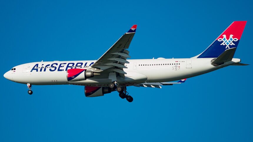 Air Serbia Airbus A330-200 flying on blue sky near JFK