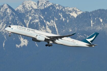 Cathay Pacific A350 departing Vancouver, snowy mountains in the background