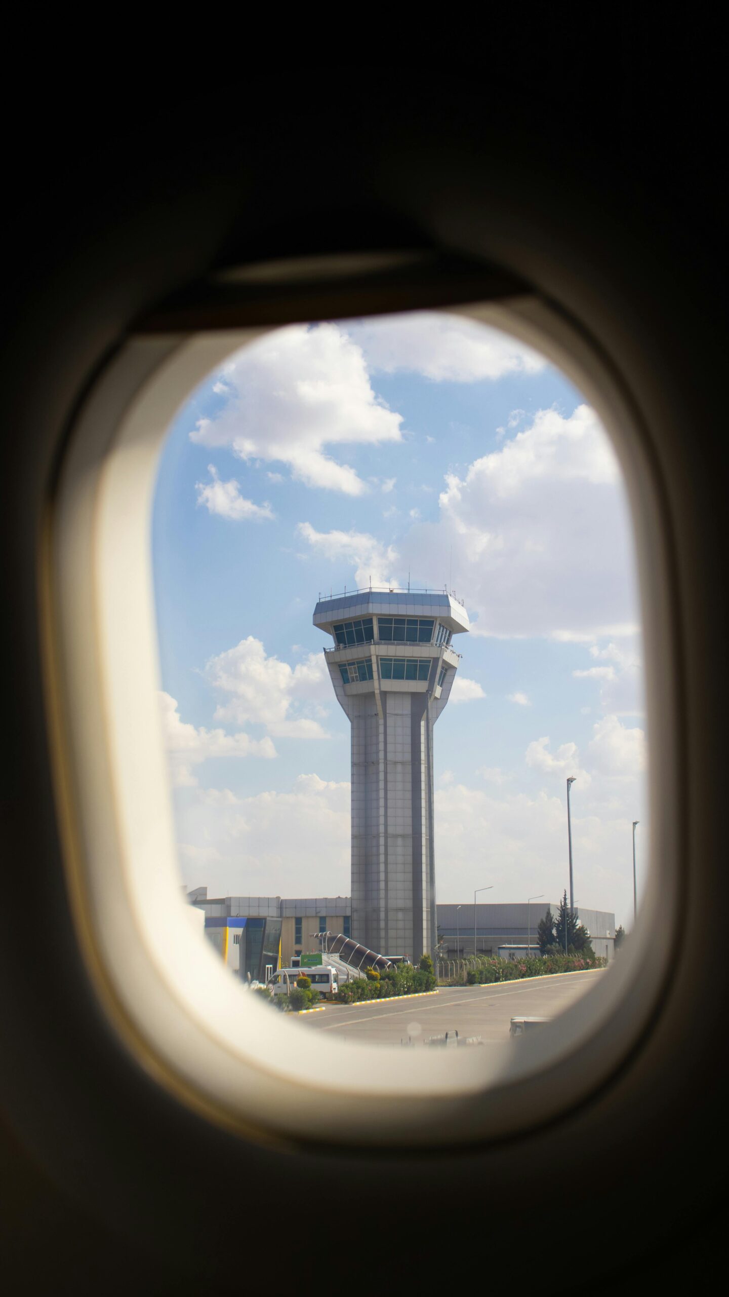 View of an Airport Traffic Control Tower from a Plane Window