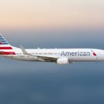 American Airlines Boeing 738 flying through the sky.