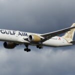 A Gulf Air B787 captured during landing at London Heathrow Airport during an overcast weather.