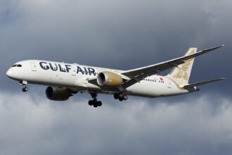 A Gulf Air B787 captured during landing at London Heathrow Airport during an overcast weather.