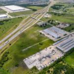 Aeriel shot of Helms Trail and Akron Way, Forney, Texas where the plane crashed. Large, open field with a building.