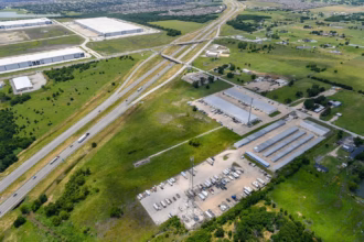 Aeriel shot of Helms Trail and Akron Way, Forney, Texas where the plane crashed. Large, open field with a building.