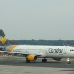 Condor Airbus A321 D-AIAE on the tarmac at Franfurt airport with grey skies and light rain.