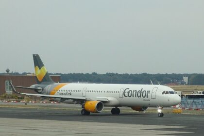 Condor Airbus A321 D-AIAE on the tarmac at Franfurt airport with grey skies and light rain.
