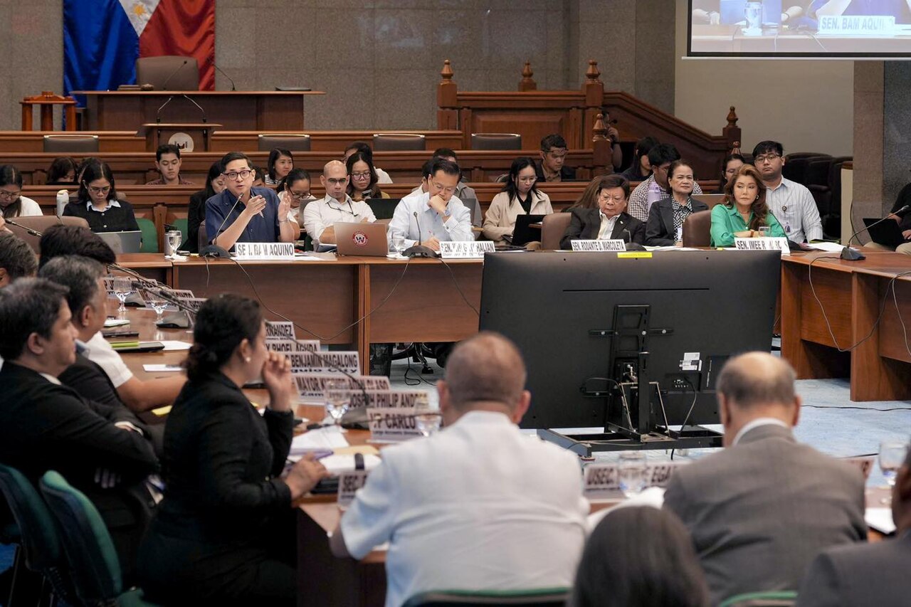 Officials and speakers participate in a Philippine Senate panel discussion on the impact of the Middle East conflict during a government oversight hearing.
