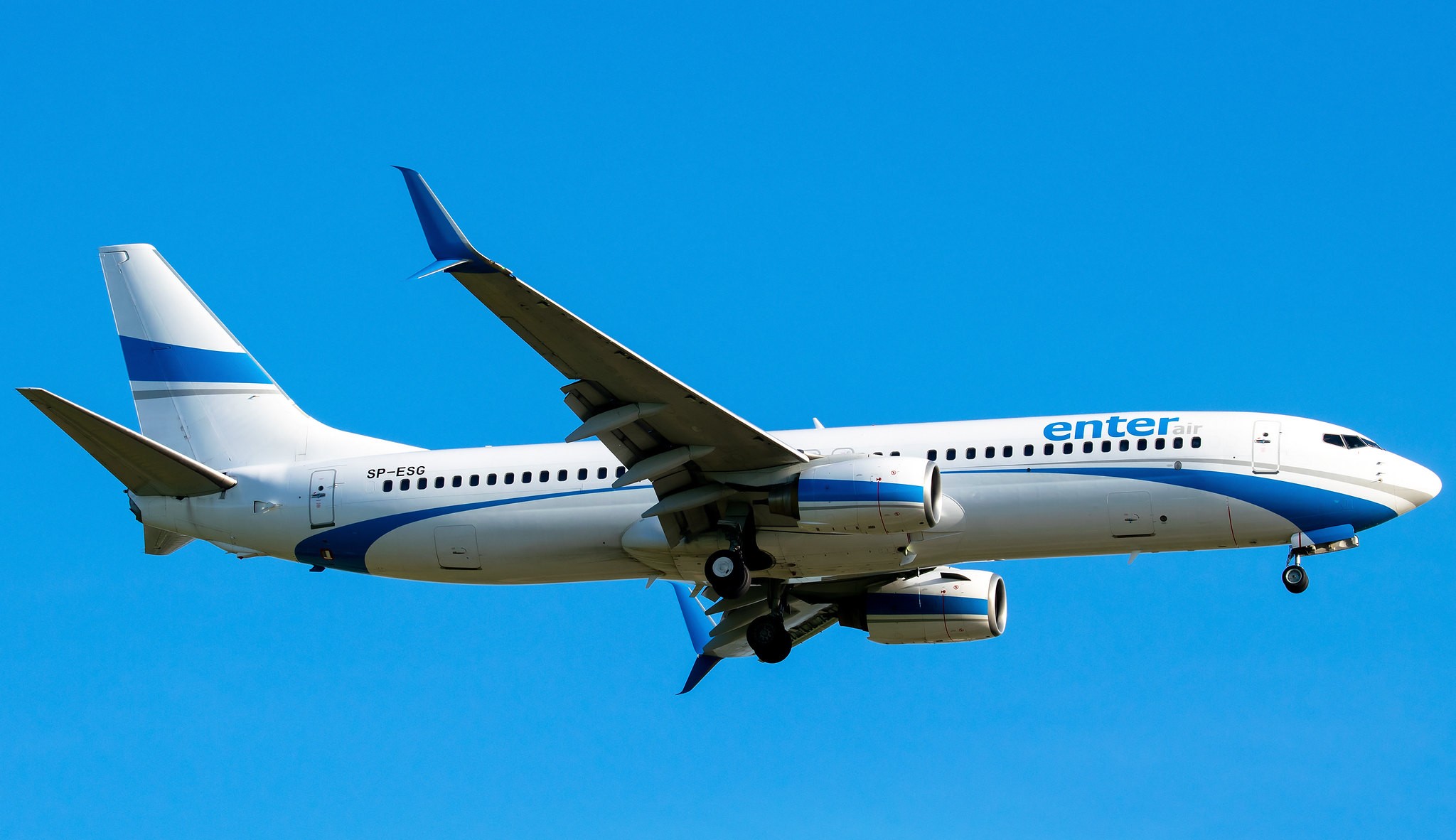 Enter Air aircraft flying in the air, clear blue sky