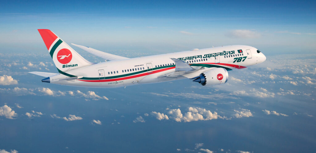 Biman Bangladesh Airlines Boeing 787 aircraft flying toward the right side. Blue sky and clouds in the background. White, green and red livery with "Biman" written in green on the tail.