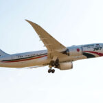 Biman Bangladesh Airlines Boeing 787 aircraft flying towards the right side. White and red livery.