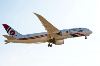 Biman Bangladesh Airlines Boeing 787 aircraft flying towards the right side. White and red livery.