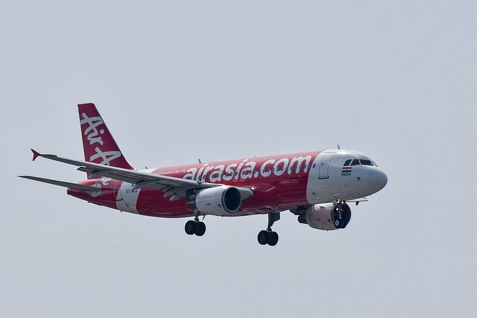 Air Asia A320 VT-MLE I5634 Kolkata-Chennai in flight, in a grey sky flying from Newcastle Airport to Chennai Airport.