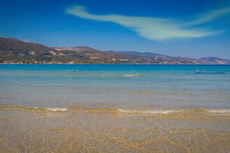 Quiet beach in Zakynthos, with blue waters and blue skies.