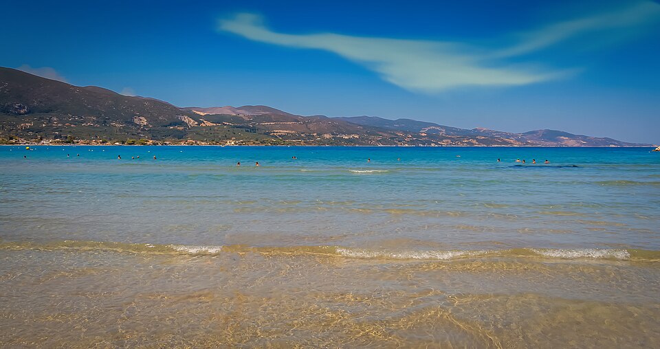 Quiet beach in Zakynthos, with blue waters and blue skies.