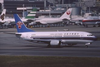 A China Southern Airlines Boeing 737-300 taxis at Hong Kong International Airport in November 1991, highlighting the carrier’s long-standing relationship with Boeing aircraft.