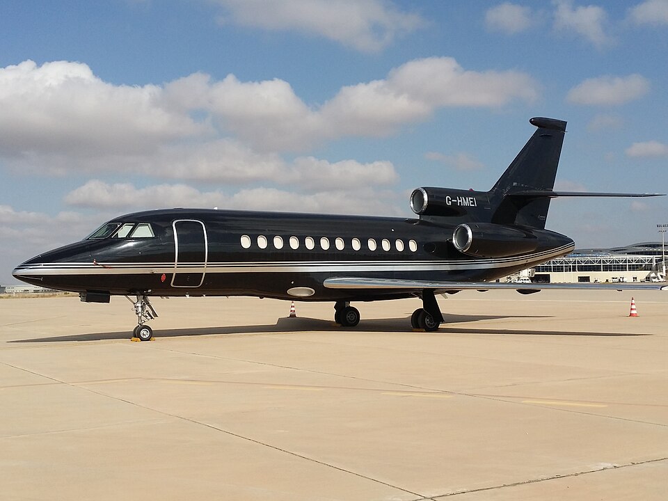 Dassault Falcon 900B private jet on the tarmac with Euro Executive livery, photographed from the front-left side.