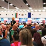 Passengers wait in a long queue at passport control inside Burgas Airport, Bulgaria, as travellers line up for border checks.