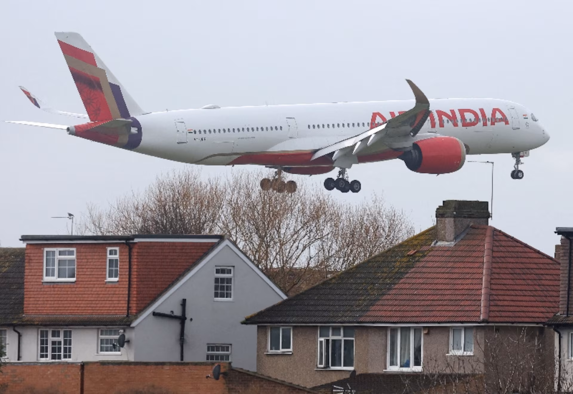 Air India aircraft approaches Heathrow Airport over residential homes in West London