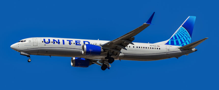 United Airlines Boeing 737 MAX 9 flying in clear blue skies