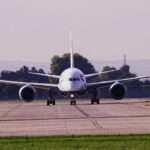 British Airways aircraft at London Heathrow Airport, on the runway before takeoff, heading towards the camera. Trees in the background.