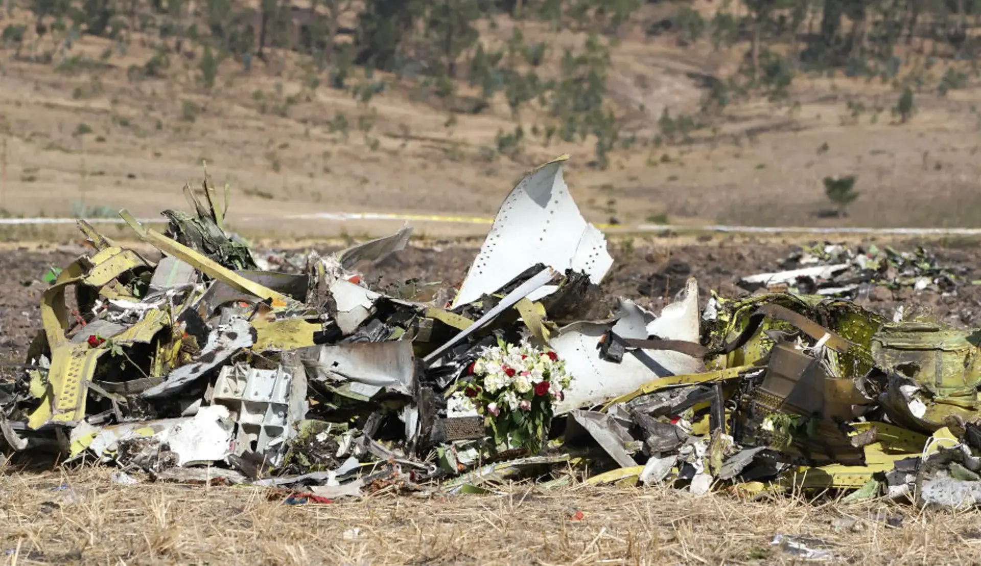 A bouquet of flowers among a pile of debris at the scene of the Ethiopian Airlines Flight 302 crash in Ejere, Ethiopia.