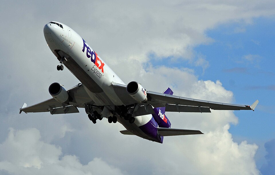 FedEx MD-11 airborne out of Anchorage, Alaska, displaying the underneath of the aircraft, including the jets and wheels