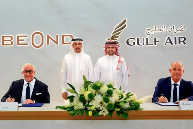 beOnd CEO Tero Taskila and Gulf Air CEO Martin Gauss signing the codeshare and loyalty partnership agreement, with Bahraini government officials present at the ceremony.