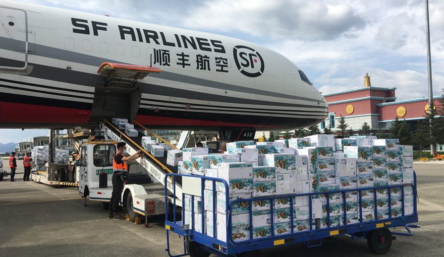 SF airlines plane being loaded with cargo