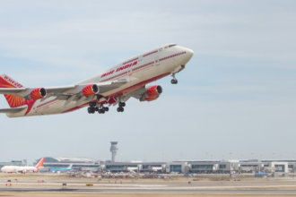 A large jetliner flying though a blue sky