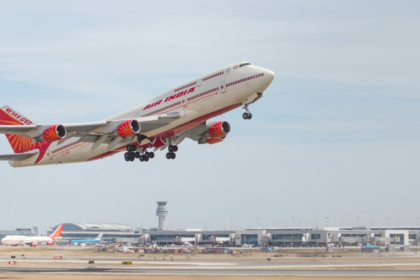 A large jetliner flying though a blue sky