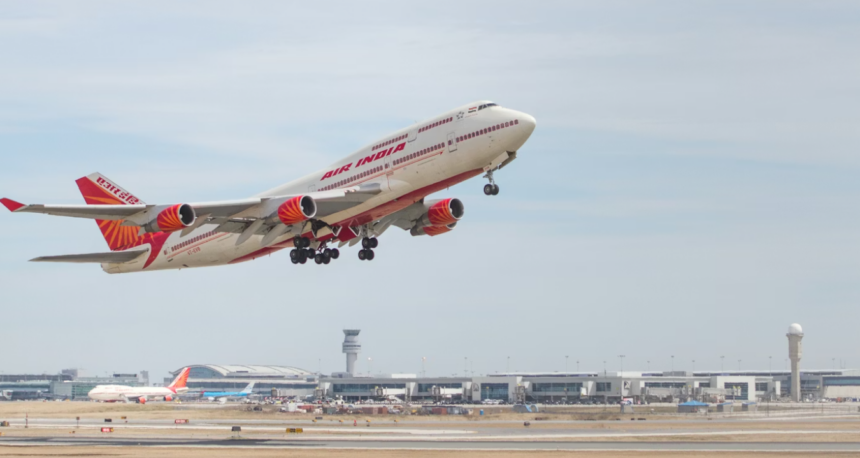 A large jetliner flying though a blue sky