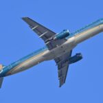 Vietnam Airlines Airbus A321 VN-A396, operating flight 579 to Hanoi, departs Taiwan Taoyuan International Airport from runway. On blue sky