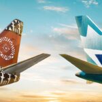 Tails of WestJet and Fiji Airways aircraft, displaying their brown and blue hues and logos.