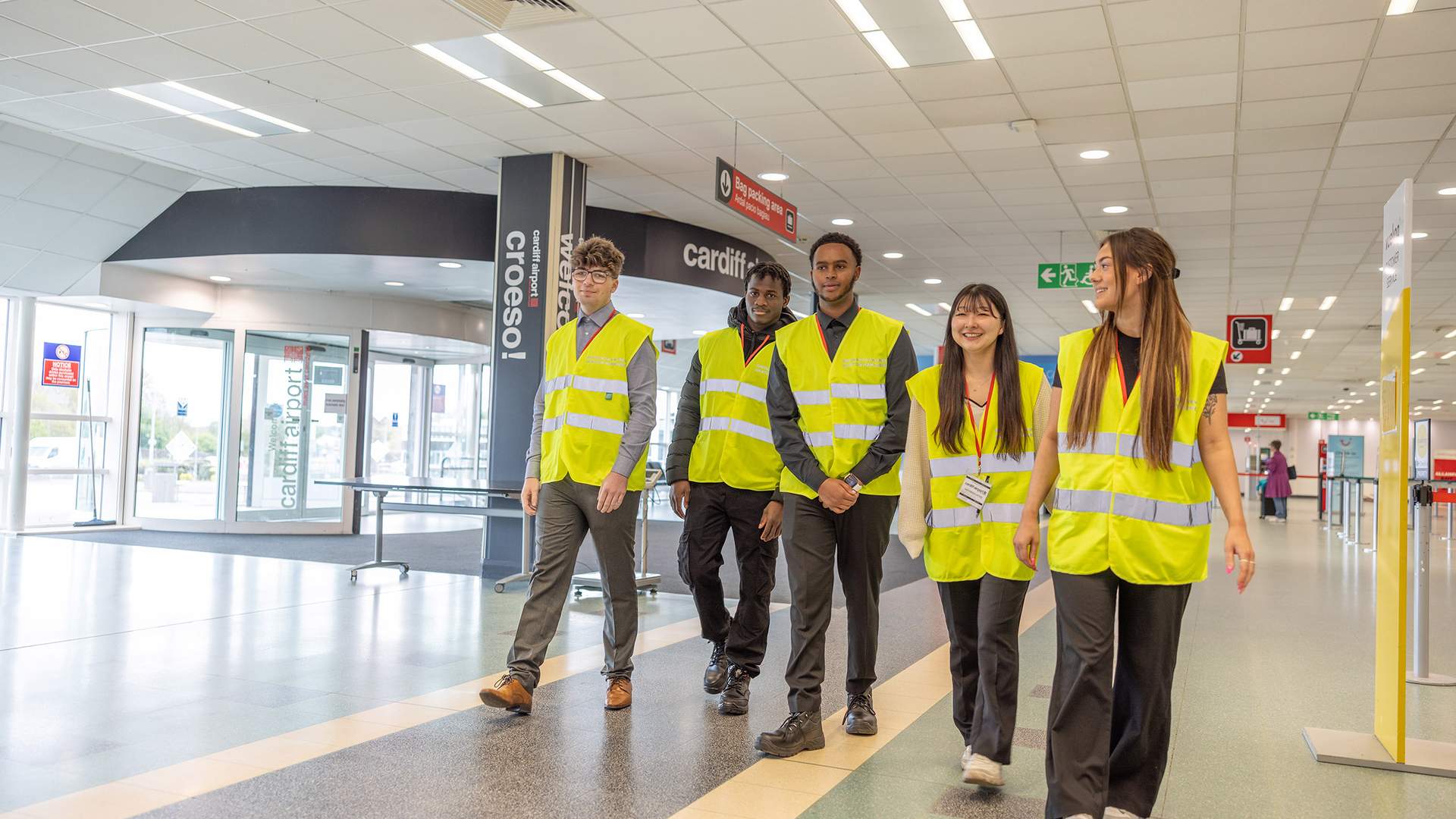 A picture of students in walking through Cardiff Airport