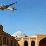 An image of an Qatar Airways Cargo aircraft flying over Doha