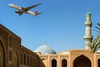 An image of an Qatar Airways Cargo aircraft flying over Doha