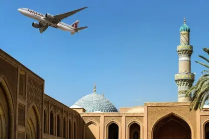 An image of an Qatar Airways Cargo aircraft flying over Doha