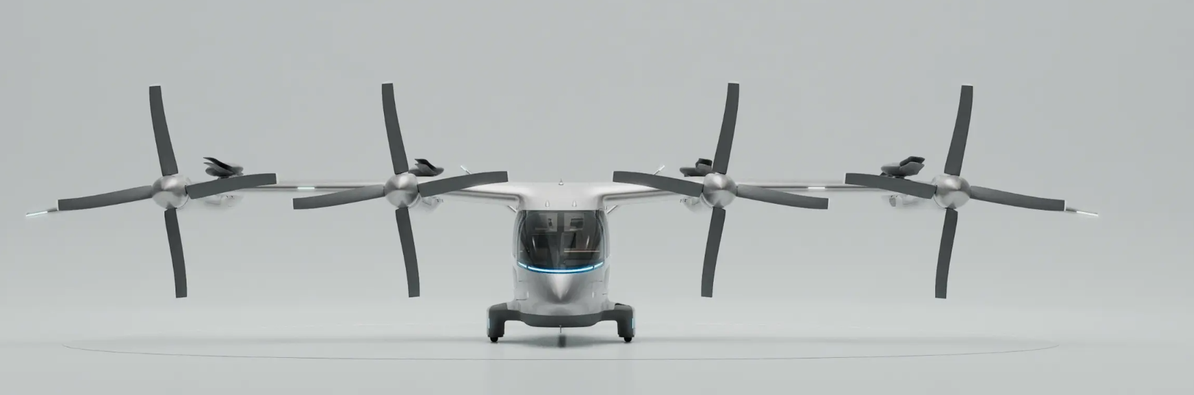 The Vertical Aerospace Valo prototype facing the camera. Four propeller engines and cockpit in view. The aircraft is against a white backdrop.