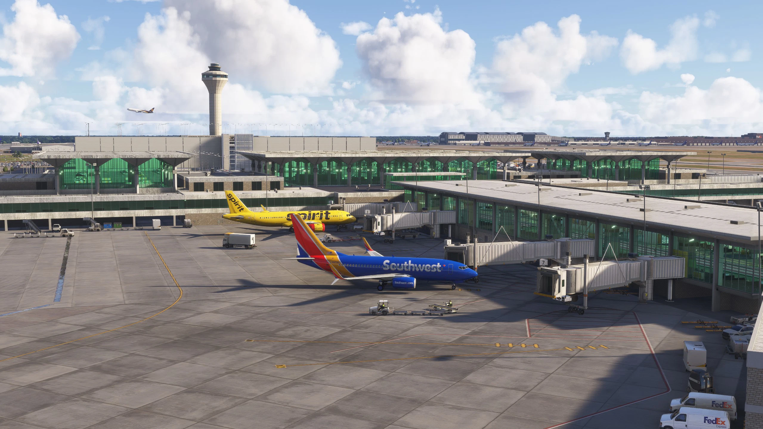 Several airport ground handling vehicles, including baggage carts and service equipment, positioned around a parked commercial aircraft as ramp personnel prepare the flight for departure.