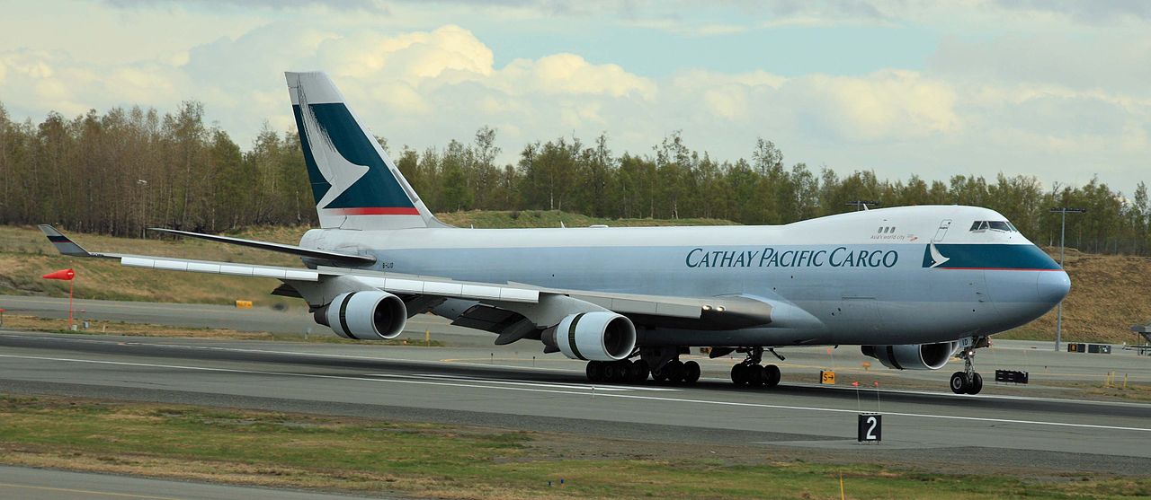 Cathay Pacific Cargo on the runway at ANC airport in clear conditions, with airline logo clearly displayed.