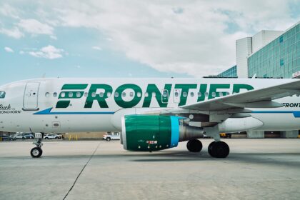 Frontier logo on aircraft from the side angle on the airport tarmac