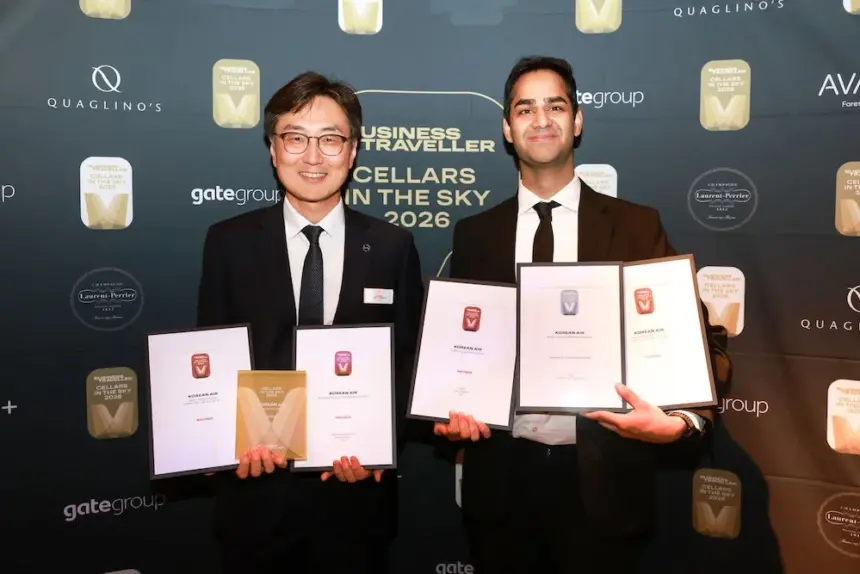 Two Korean Air representatives with their awards at the 2026 Cellars in the Sky Awards.